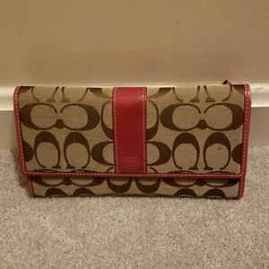 Coach wallet with coach pattern and pink trim